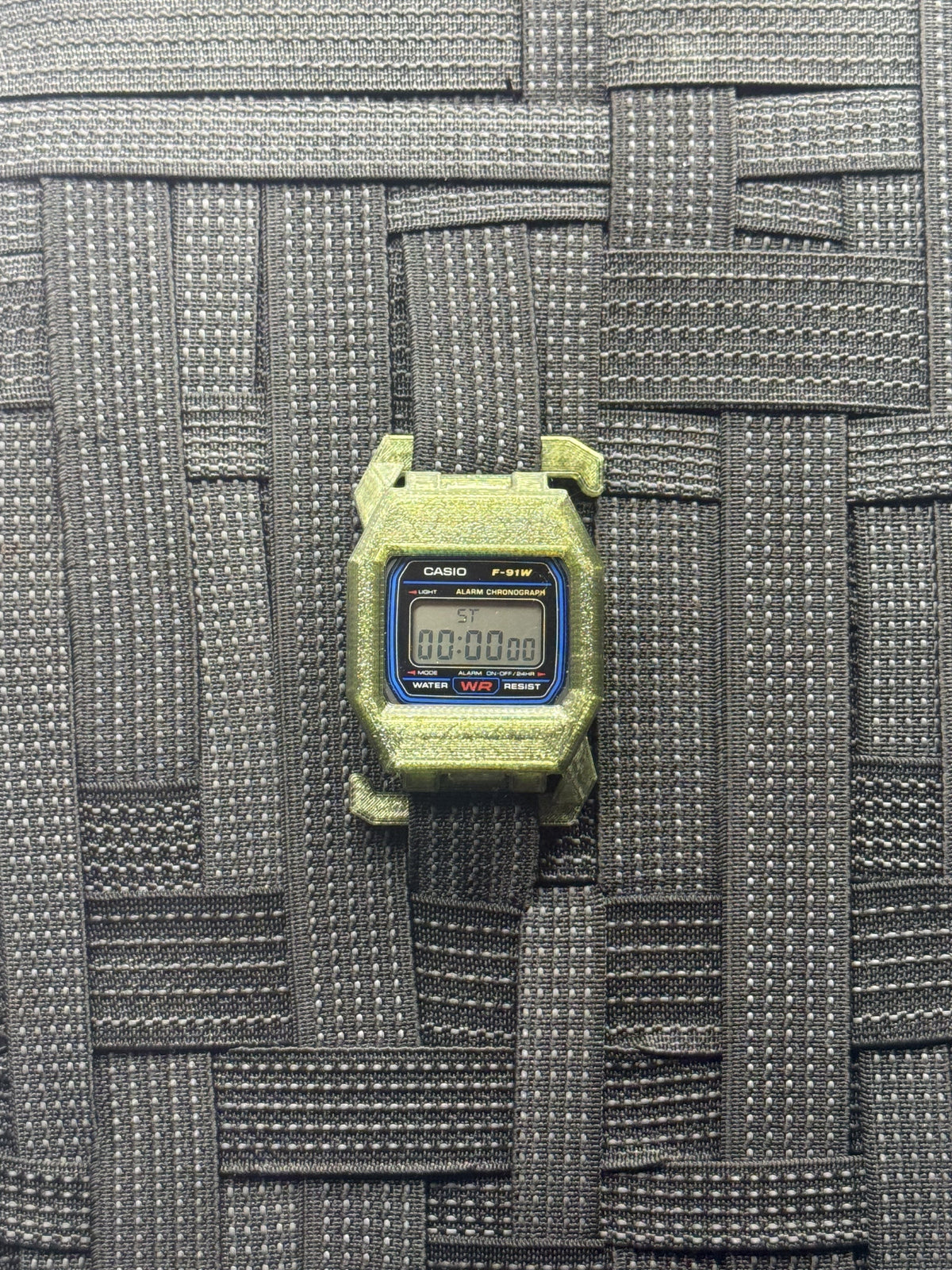 F91 Molle Case — Olive Green on MOLLE webbing