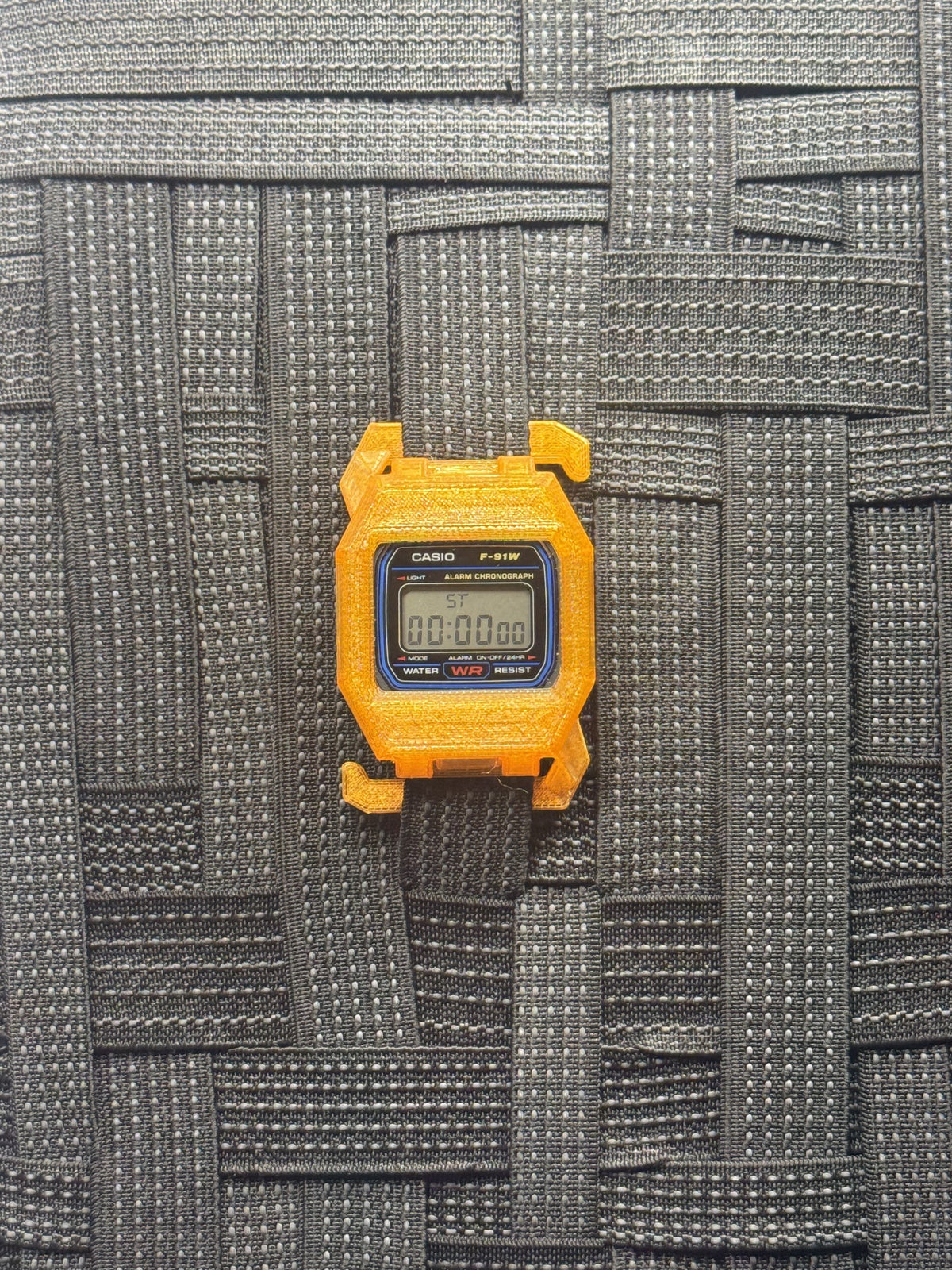 F91 Molle Case — Proto Orange on MOLLE webbing