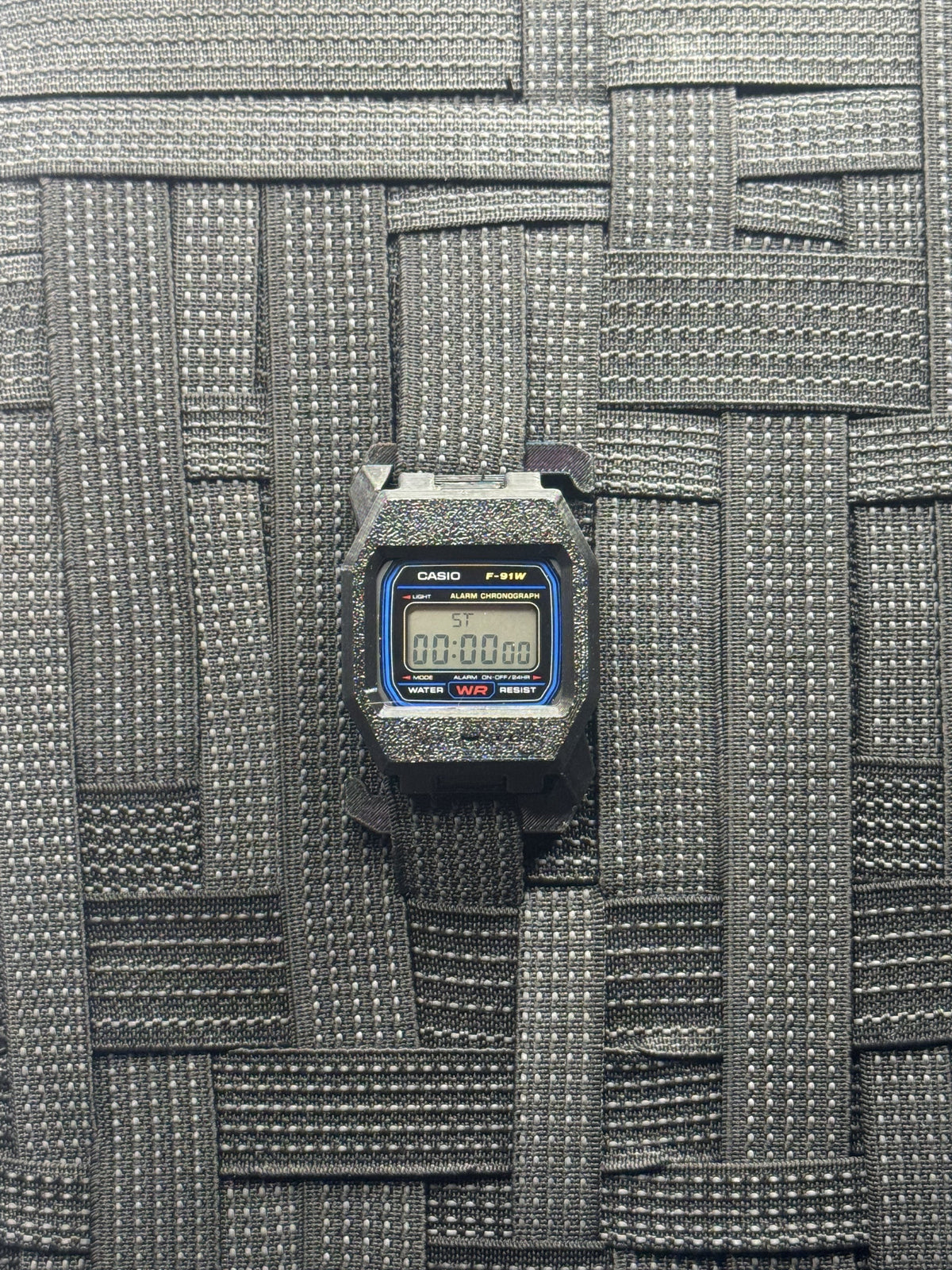 F91 Molle Case — Stealth Black on MOLLE webbing