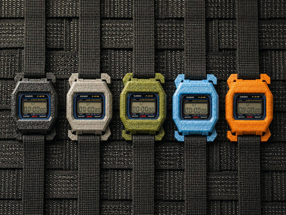 F91 MOLLE cases in the full colour run, laid out on MOLLE webbing