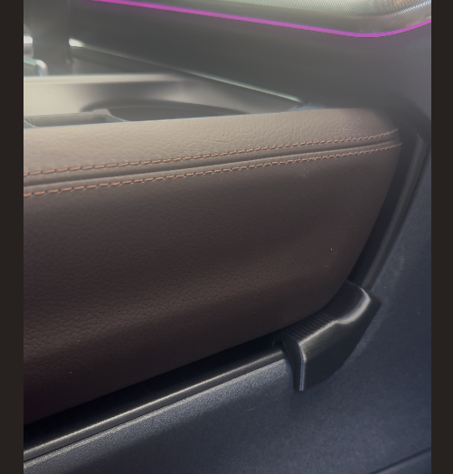 The Saddle installed on the 2025+ Ford Expedition center console tray, adding support and eliminating tray flex.